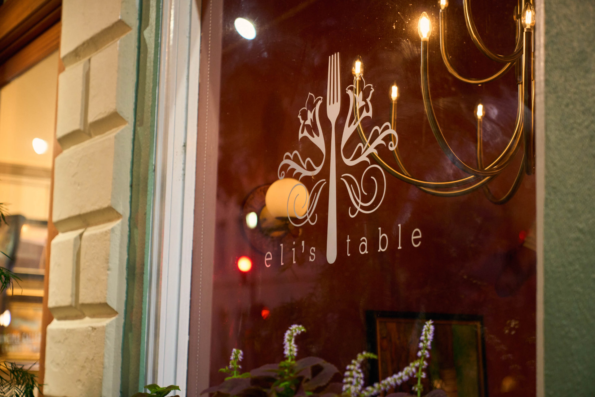 The Eli's Table logo on the front window at 129 Meeting Street in downtown Charleston